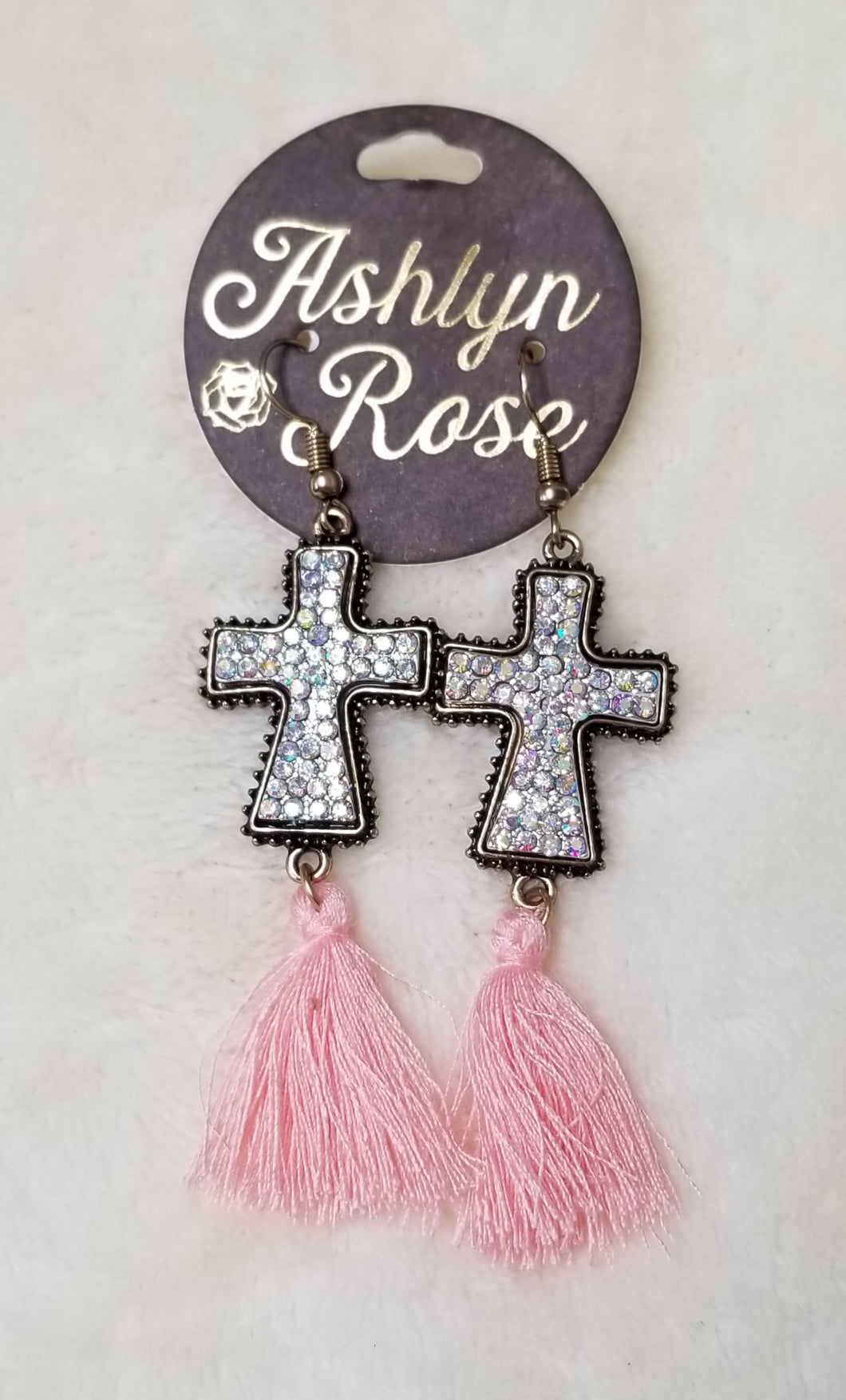Cross earings with pink tassels